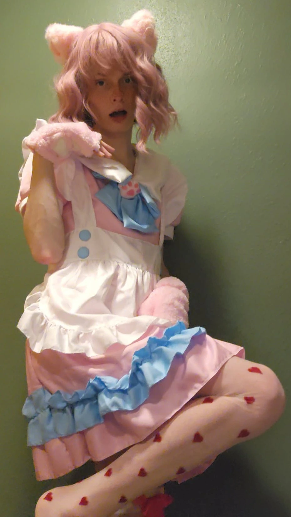 An adorable pink, white, and blue cat maid outfit